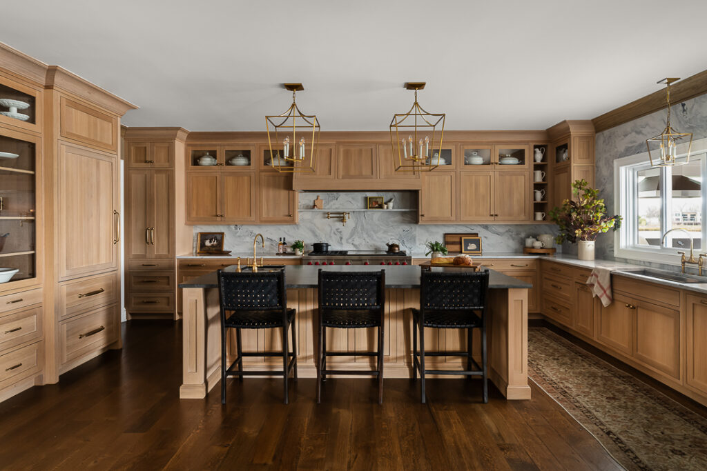 Luxury Kitchen Design, wood-finished cabinetry, statement chandeliers, and functionality with Town & Country Design by Tori Sikkema Photography