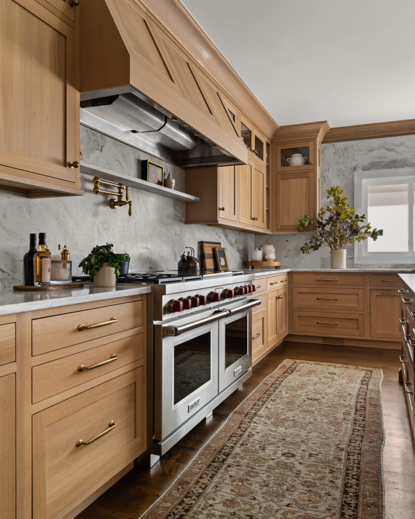 Luxury Kitchen Design, wood-finished cabinetry, statement chandeliers, and functionality with Town & Country Design by Tori Sikkema Photography