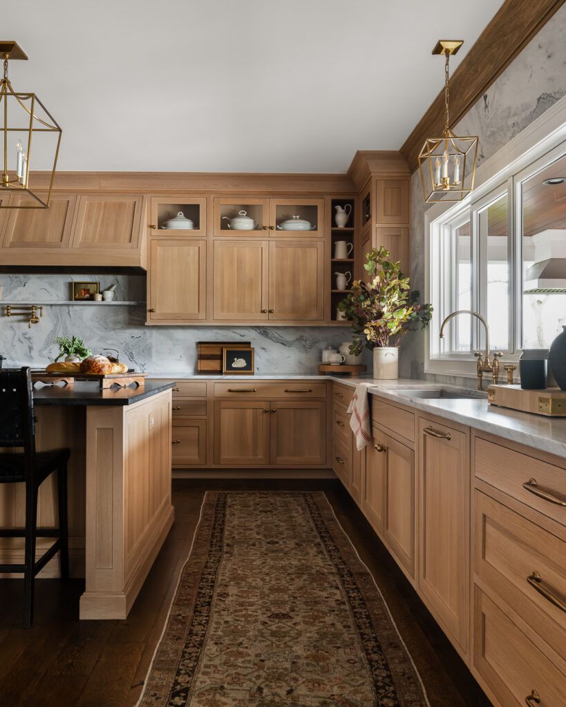 Luxury Kitchen Design, wood-finished cabinetry, statement chandeliers, and functionality with Town & Country Design by Tori Sikkema Photography