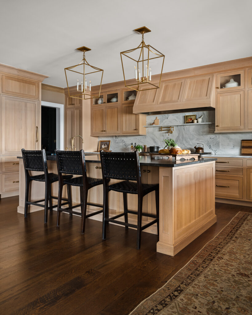 Luxury Kitchen Design, wood-finished cabinetry, statement chandeliers, and functionality with Town & Country Design by Tori Sikkema Photography