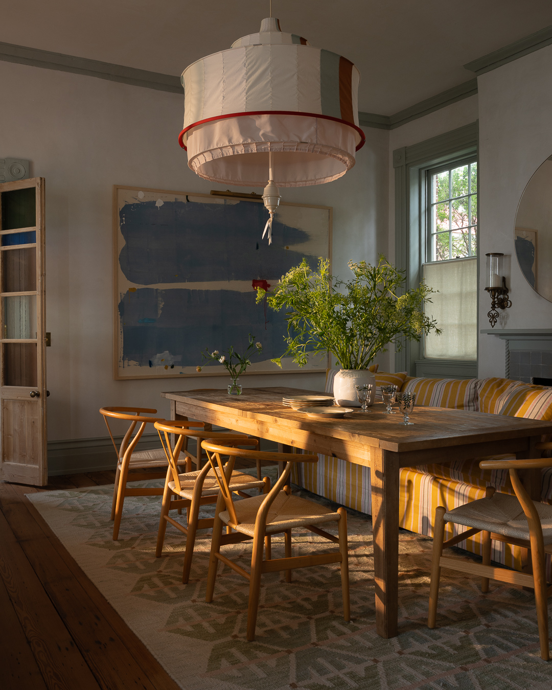 Charleston Dining Room with art and an incredible chandelier.