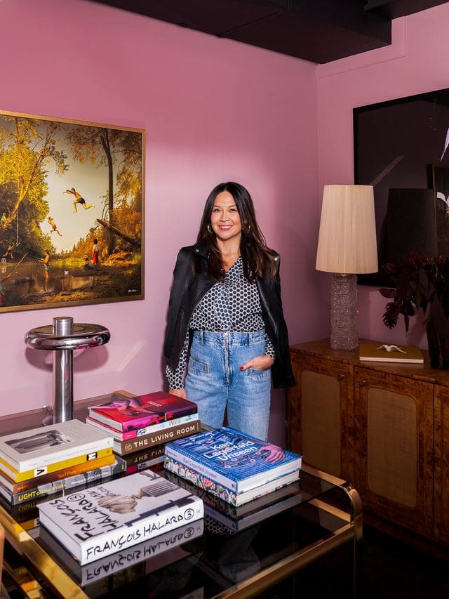 Editorial portrait of interior designer Christina Kim in a color-rich, sculptural interior