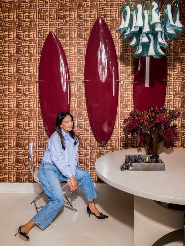 Editorial portrait of interior designer Christina Kim in a color-rich, sculptural interior