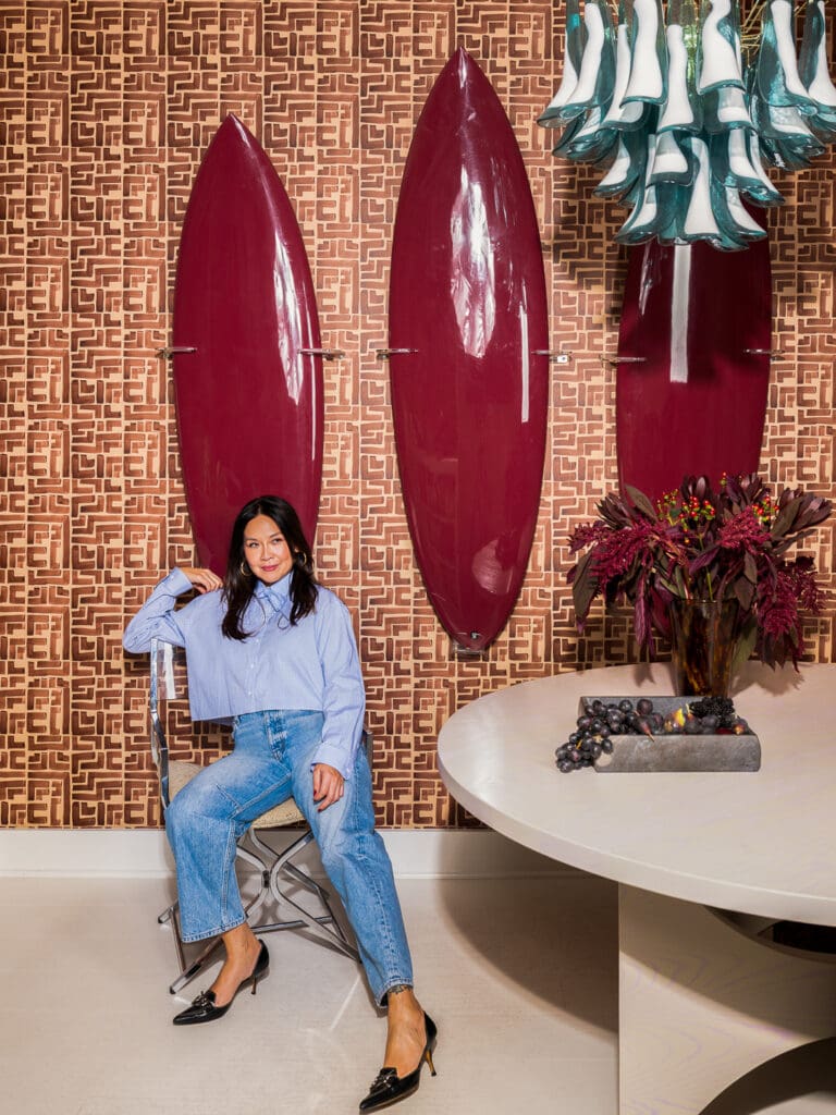 Editorial portrait of interior designer Christina Kim in a color-rich, sculptural interior