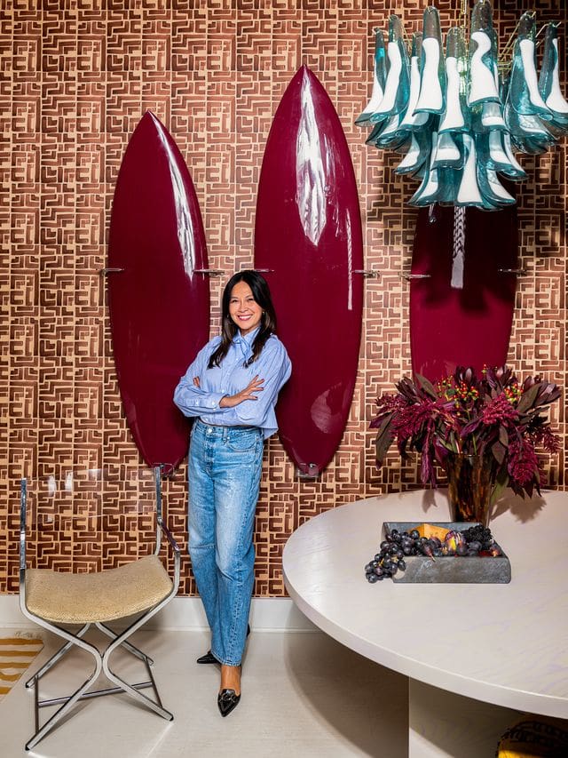 Editorial portrait of interior designer Christina Kim in a color-rich, sculptural interior